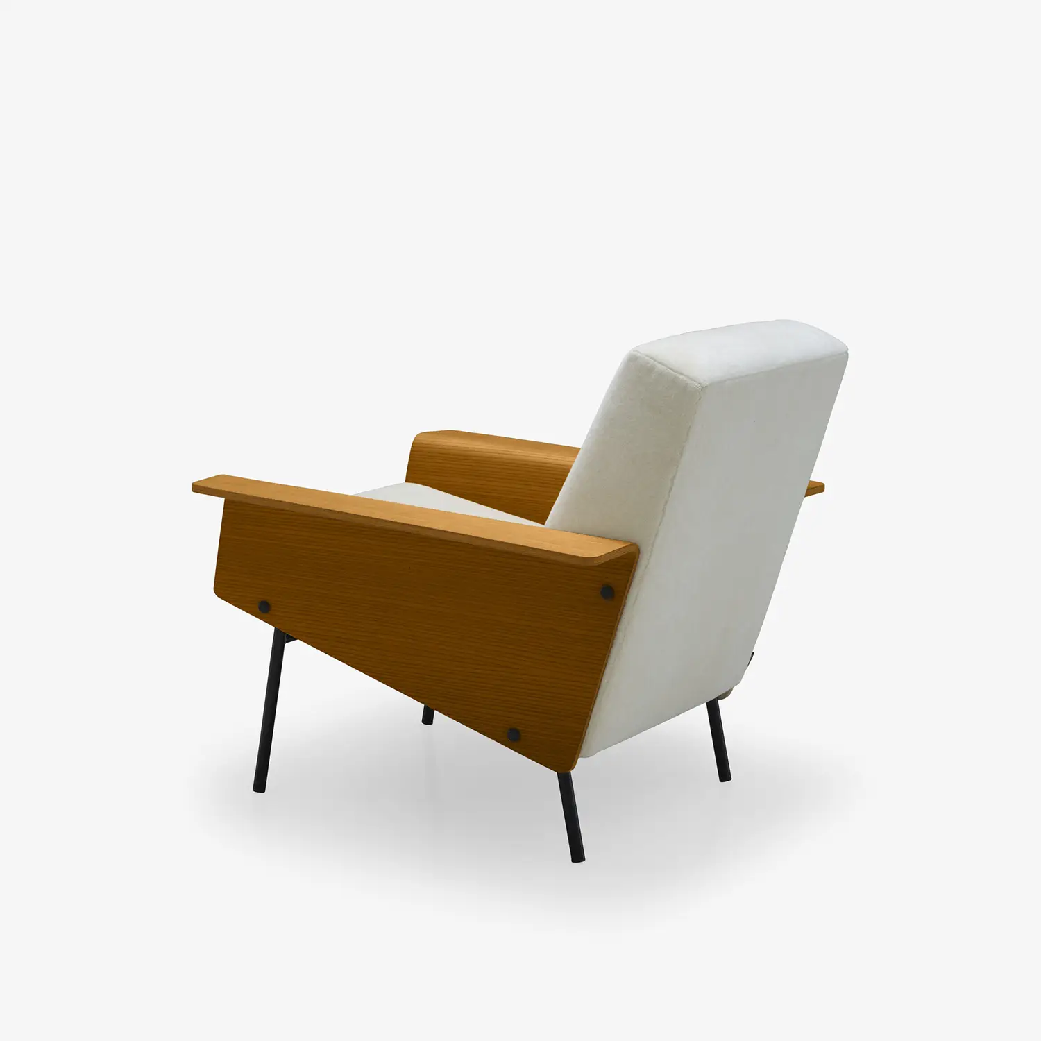 White upholstered armchair with angled wooden armrests and black metal legs.